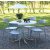 Spisegruppe Holmsund: Rundt hvitt bord inkludert 4 stk. stablebare Abbe-stoler